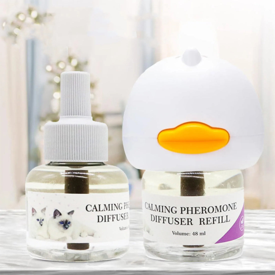 Calming pheromone refill bottle next to the white plug-in diffuser on a shelf