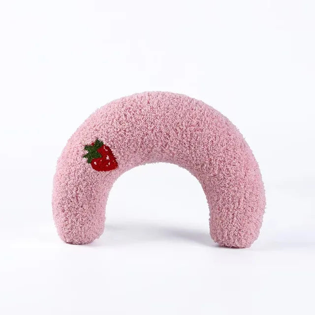 Pink half-moon cat pillow with an embroidered strawberry