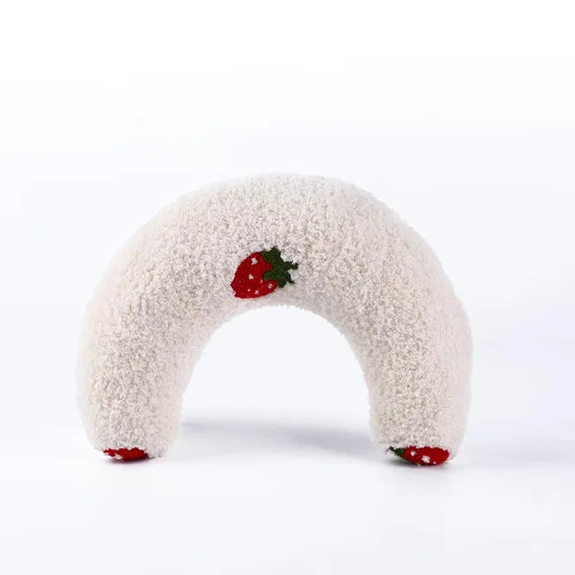 Cream half-moon cat pillow with embroidered strawberries