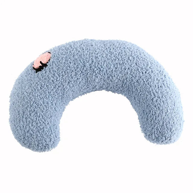 Blue half-moon cat pillow with a small embroidered pig