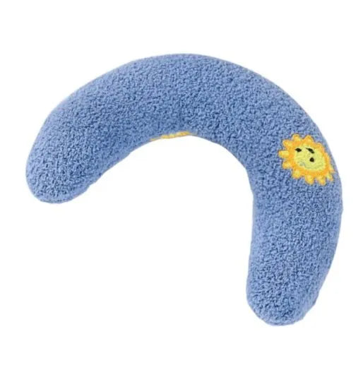 Blue half-moon cat pillow with an embroidered sun