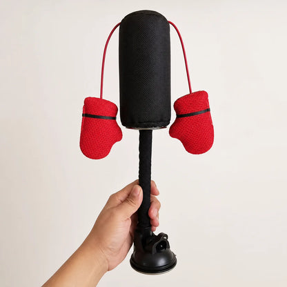 KittyKO cat punching bag held in a hand showing its real size